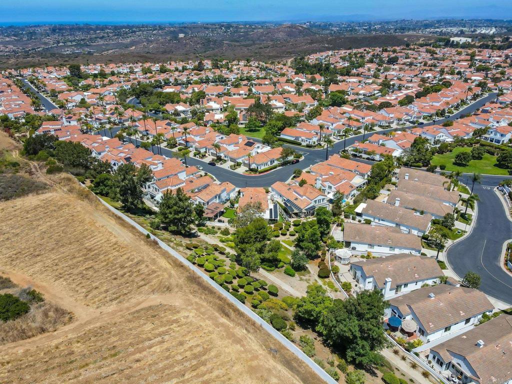 4939 Tilos Way Oceanside, CA 92056 - Photo 36 of 49 an aerial view of residential houses with outdoor space