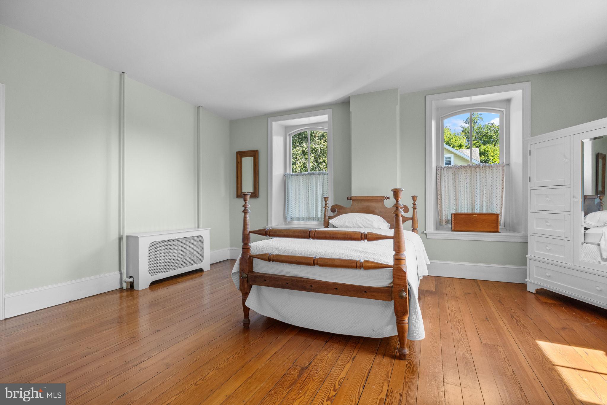 411 East Mill Road Flourtown, PA 19031 - Photo 25 of 62 a bedroom with furniture and a wooden floor