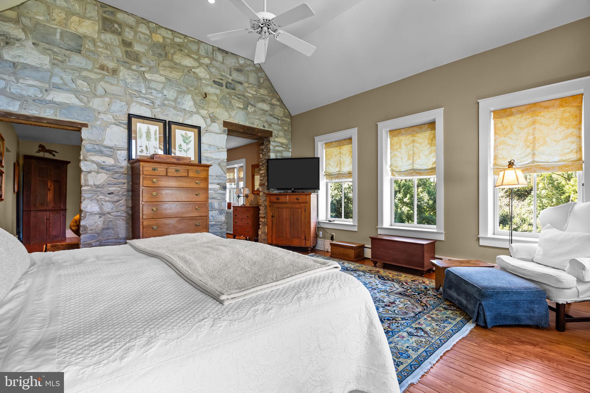 411 East Mill Road Flourtown, PA 19031 - Photo 33 of 62 a bedroom with a bed and wooden floor