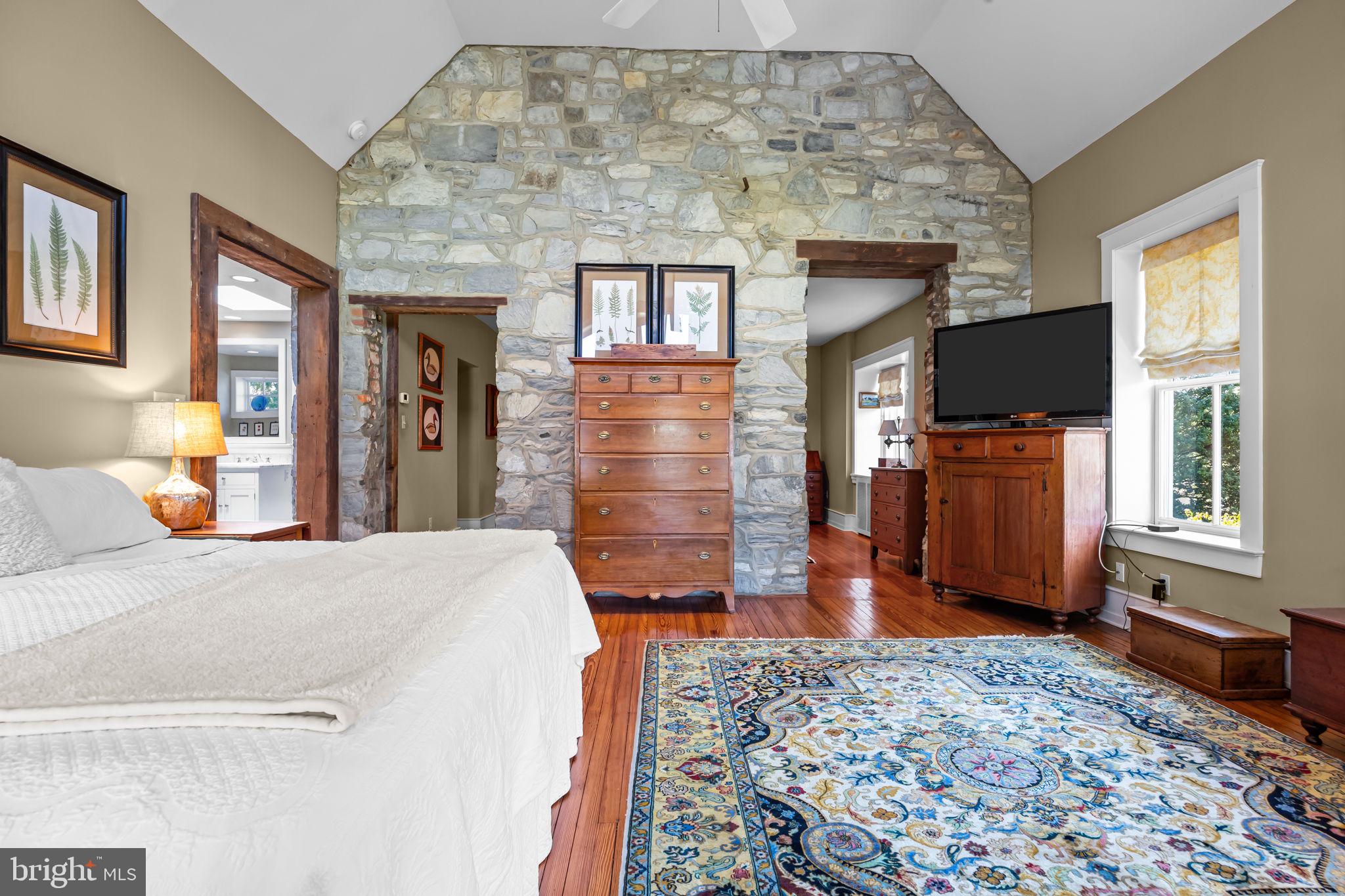 411 East Mill Road Flourtown, PA 19031 - Photo 34 of 62 a bedroom with a bed and wooden floor