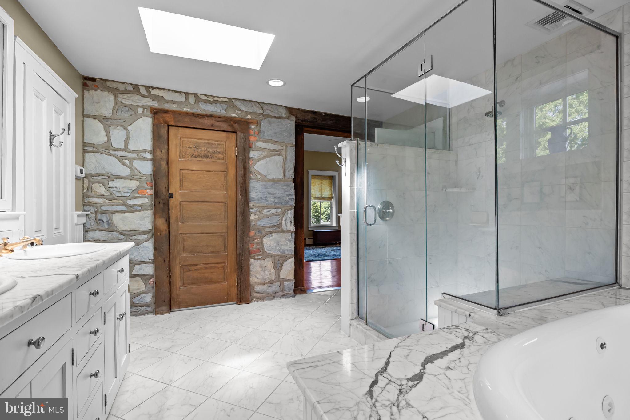 411 East Mill Road Flourtown, PA 19031 - Photo 38 of 62 Exposed stone within the owners' ensuite