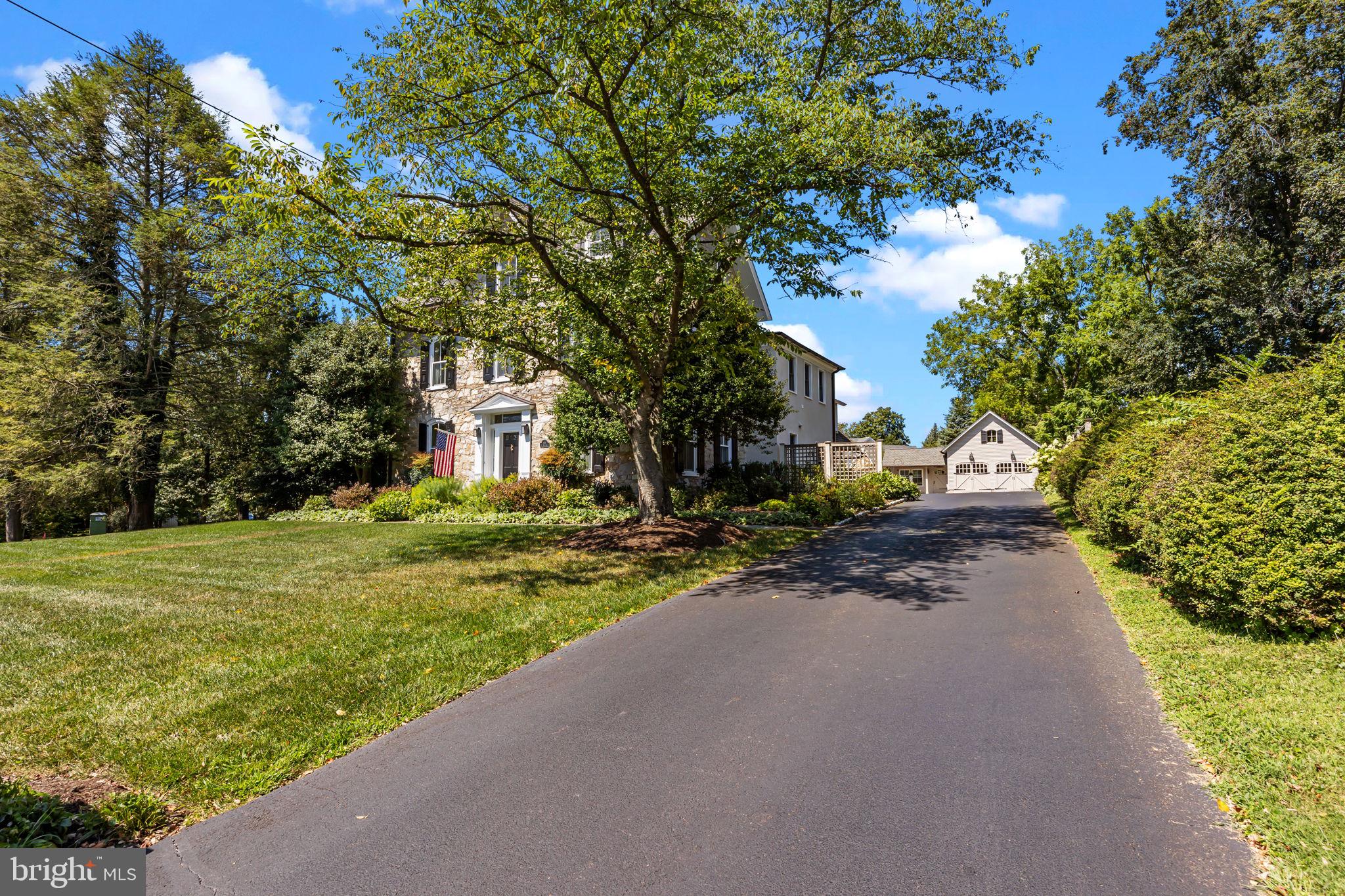 411 East Mill Road Flourtown, PA 19031 - Photo 4 of 62 a view of a house with a yard and tree s