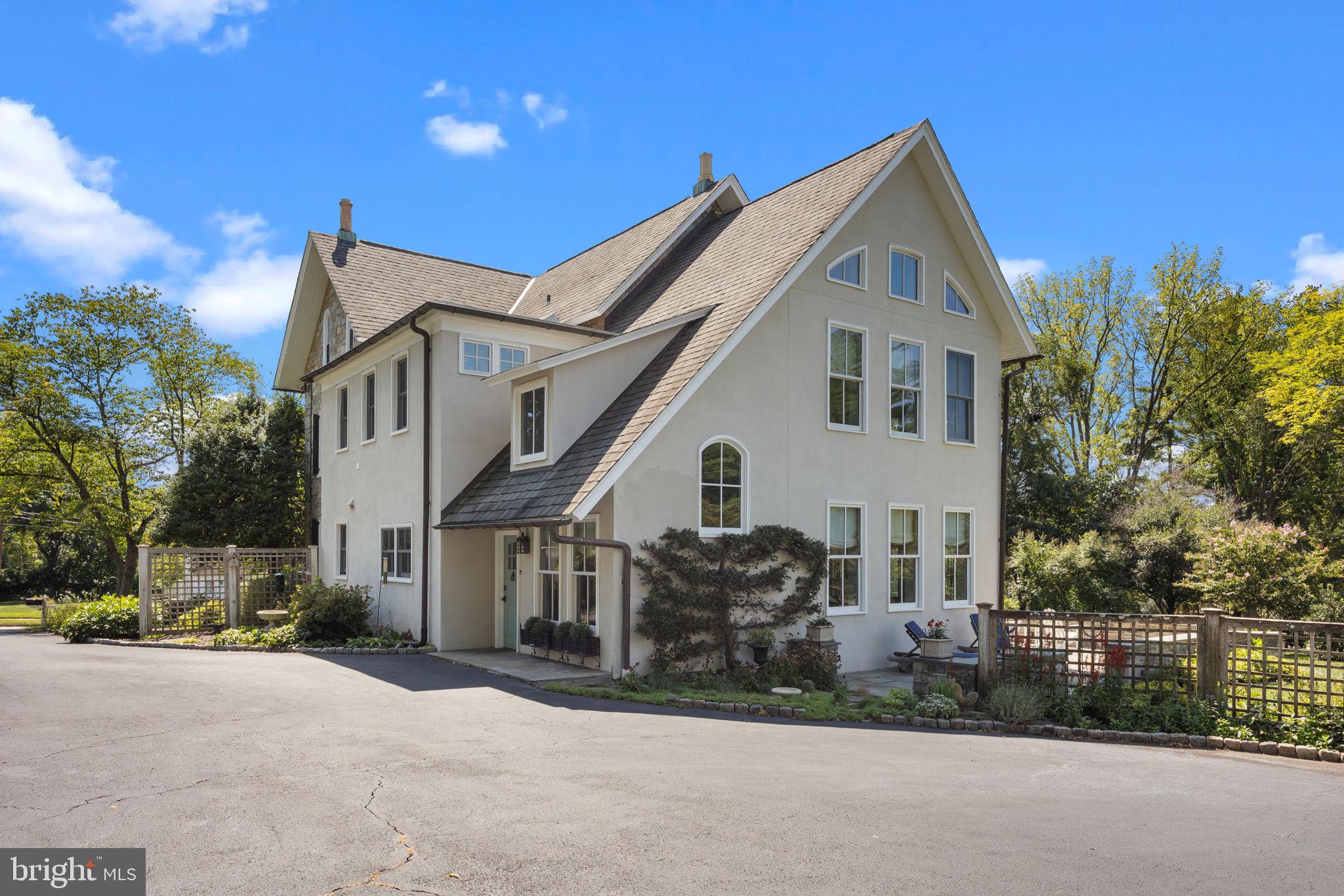 411 East Mill Road Flourtown, PA 19031 - Photo 6 of 62 a view of a white house with a street