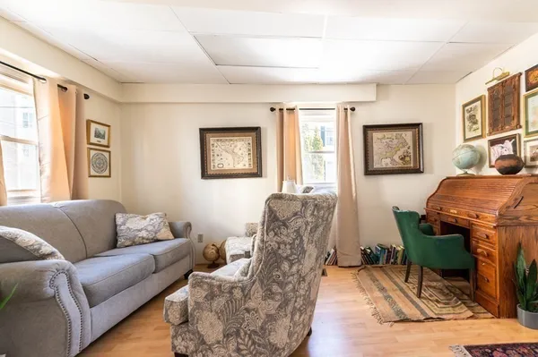 a living room with furniture and a window