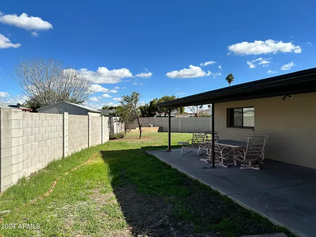 a view of a backyard with garden