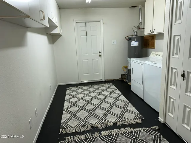 a room with a washer and dryer