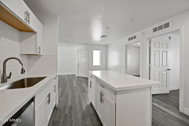 a kitchen with a stove and a microwave