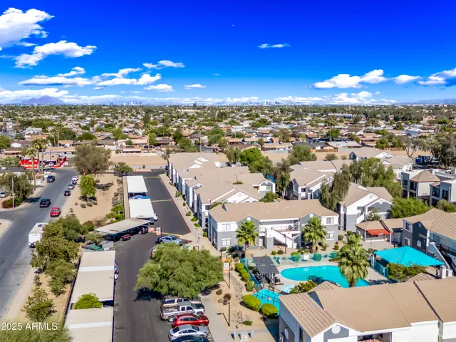 an aerial view of residential house with outdoor space and swimming pool