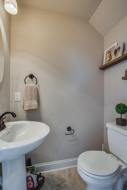 11 Remington Road Lebanon, TN 37090 - Photo 15 of 29 a bathroom with a sink mirror and toilet