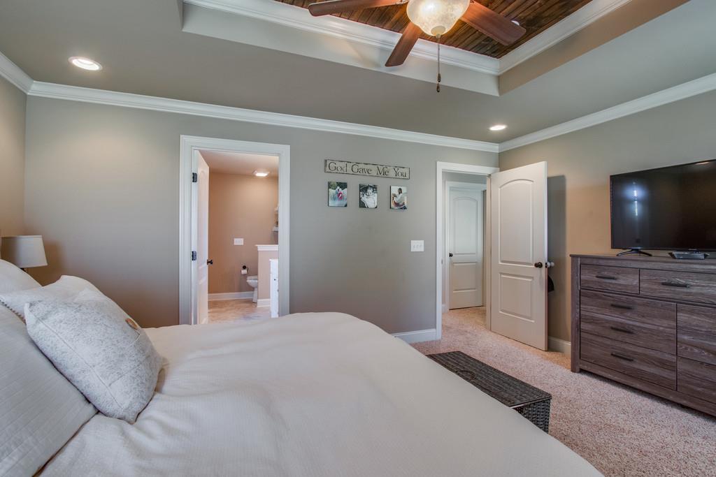 11 Remington Road Lebanon, TN 37090 - Photo 17 of 29 a bedroom with a bed and a flat screen tv