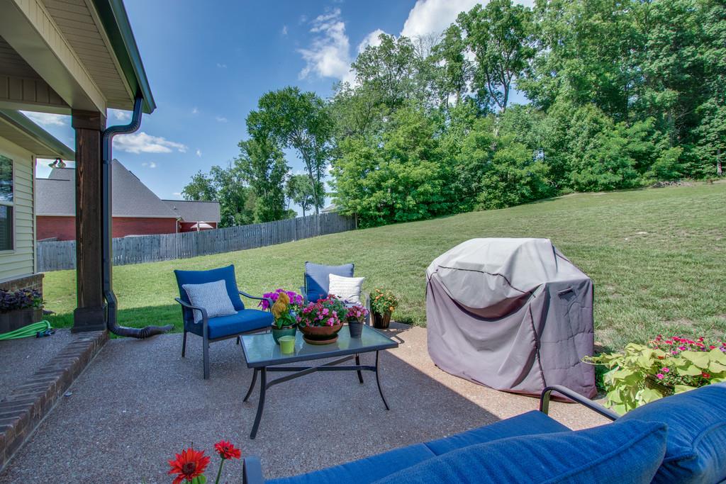 11 Remington Road Lebanon, TN 37090 - Photo 26 of 29 a chair and table sitting in backyard of the house