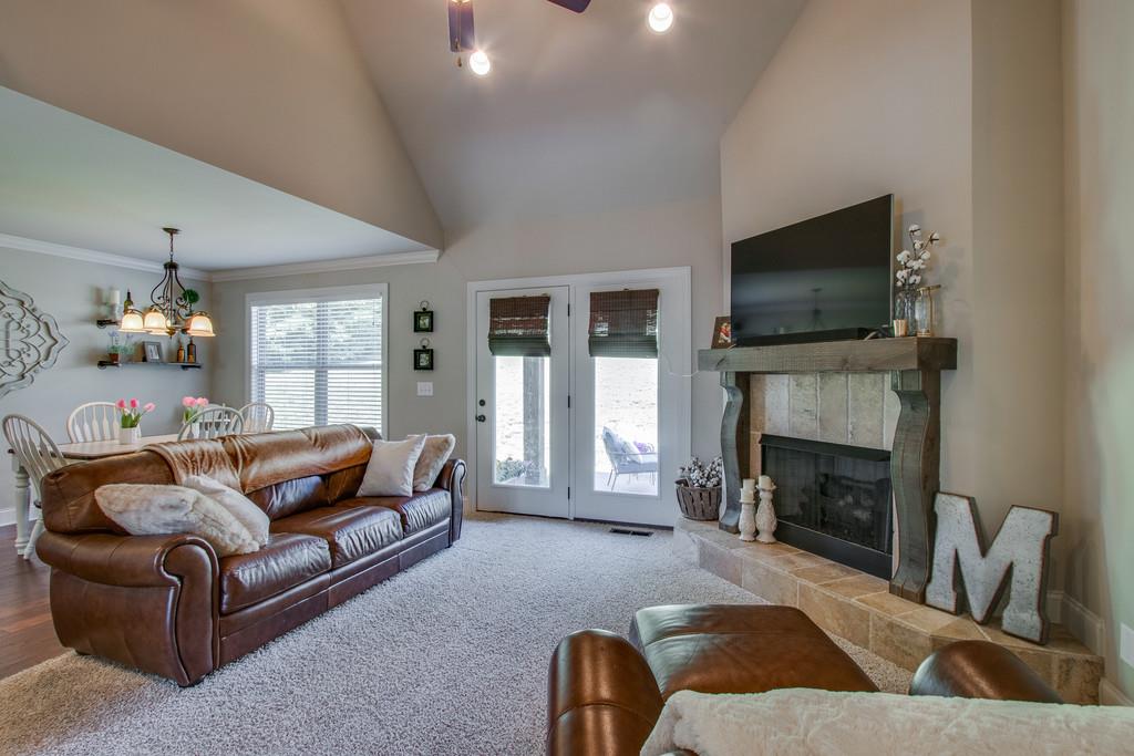 11 Remington Road Lebanon, TN 37090 - Photo 9 of 29 a living room with furniture a fireplace and a flat screen tv