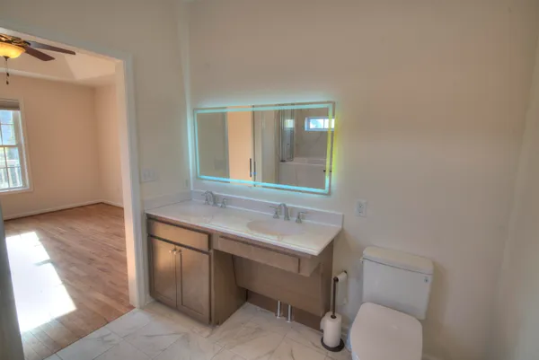 a bath tub sitting next to a white sink