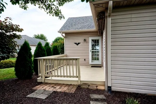 an aerial view of a house with yard