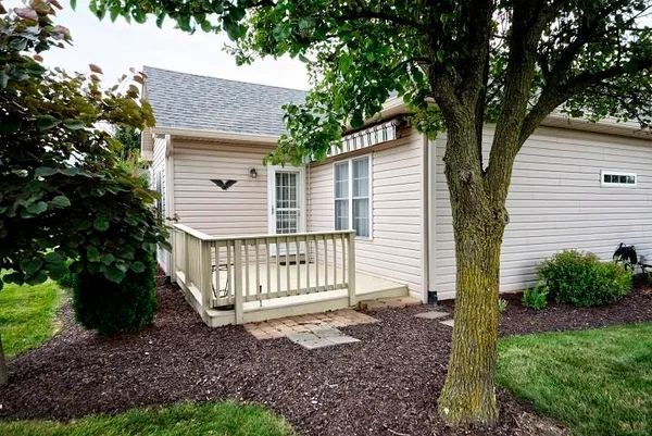 a view of a garden with an outdoor seating