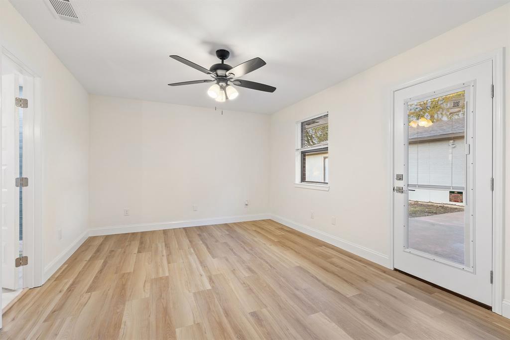 403 East 8th Street Prosper, TX 75078 - Photo 11 of 34 wooden floor in an empty room with a window
