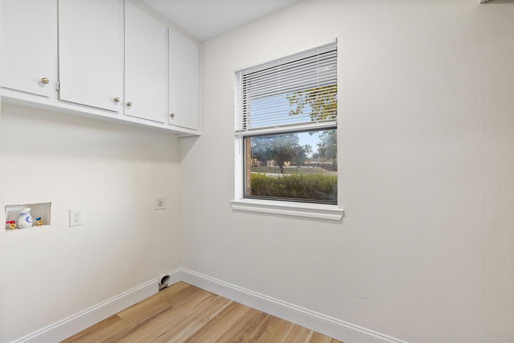 403 East 8th Street Prosper, TX 75078 - Photo 19 of 34 a view of a small space with wooden floor and a window