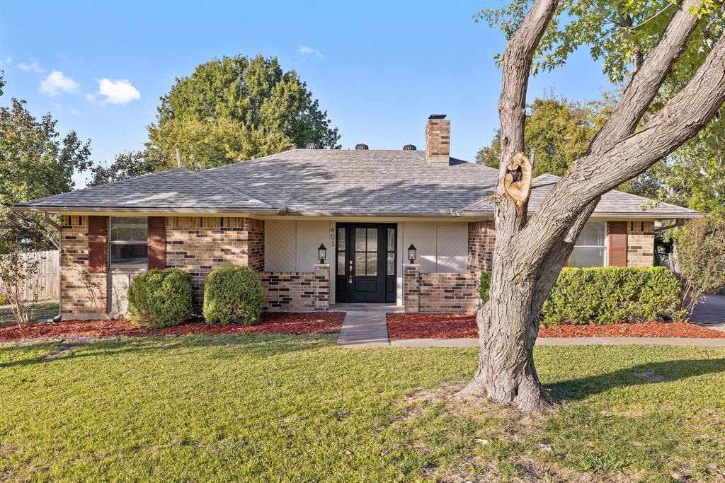 403 East 8th Street Prosper, TX 75078 - Photo 31 of 34 a front view of a house with garden