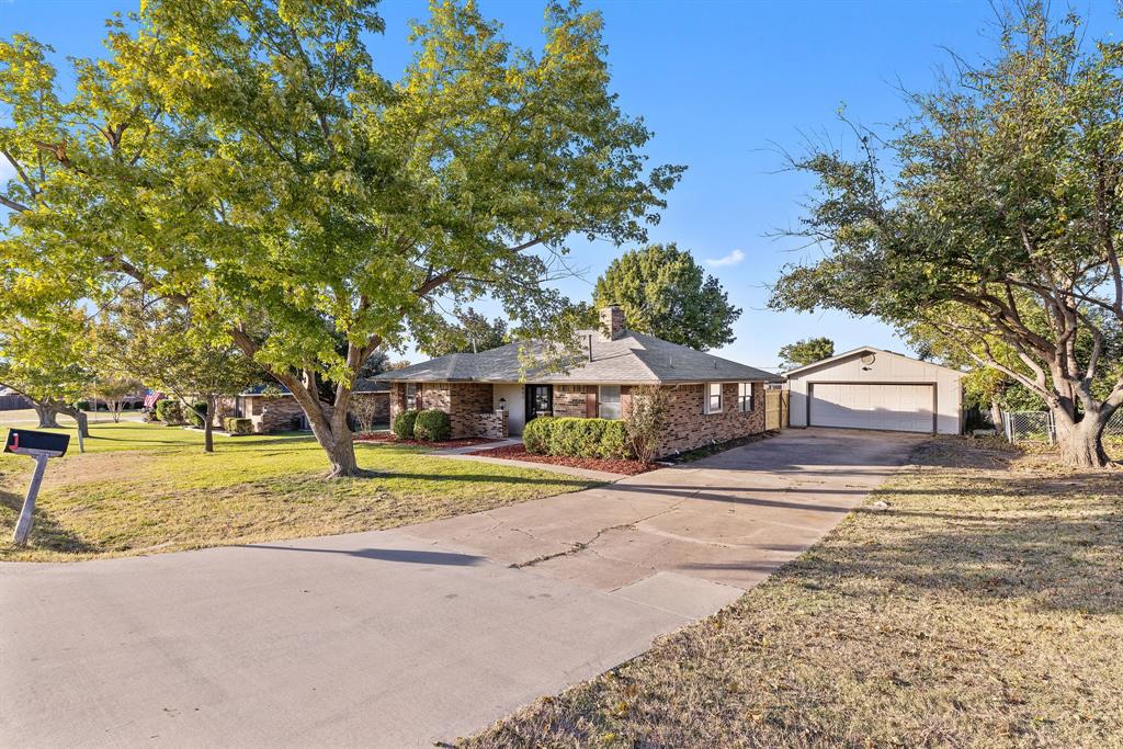 403 East 8th Street Prosper, TX 75078 - Photo 32 of 34 a front view of a house with a yard and trees