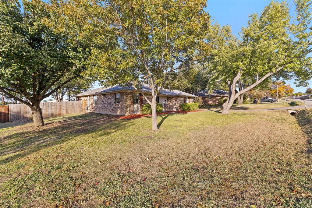 403 East 8th Street Prosper, TX 75078 - Photo 33 of 34 a view of a yard with trees