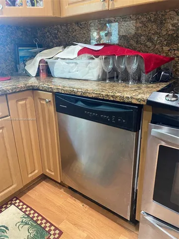 a stove top oven sitting inside of a kitchen