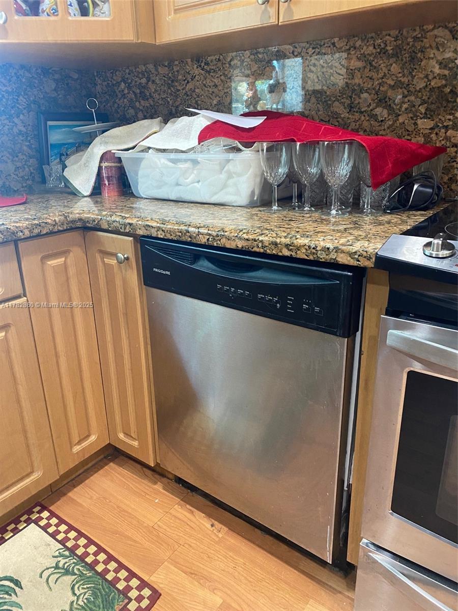 6331 Southwest 17th Street West Miami, FL 33155 - Photo 14 of 42 a room with stainless steel appliances granite countertop a stove and a microwave oven