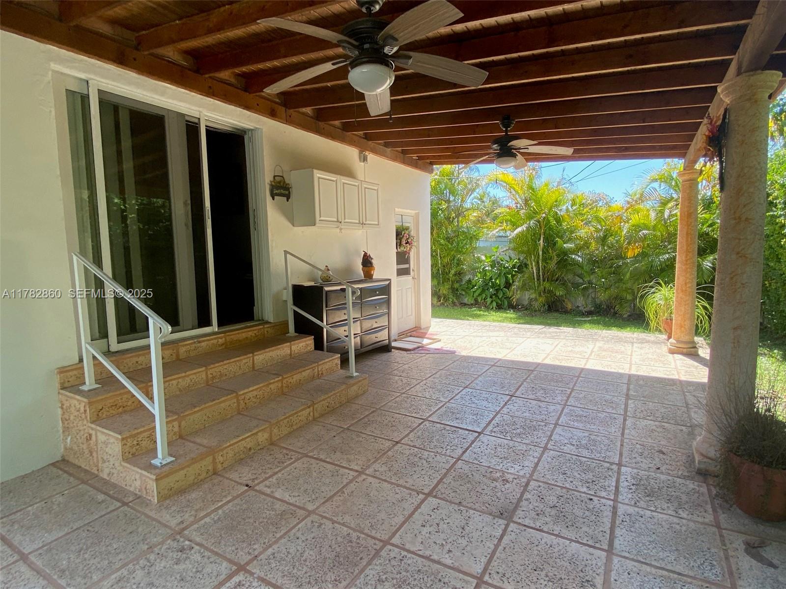 6331 Southwest 17th Street West Miami, FL 33155 - Photo 23 of 42 a view of a room with wooden floor and outdoor space