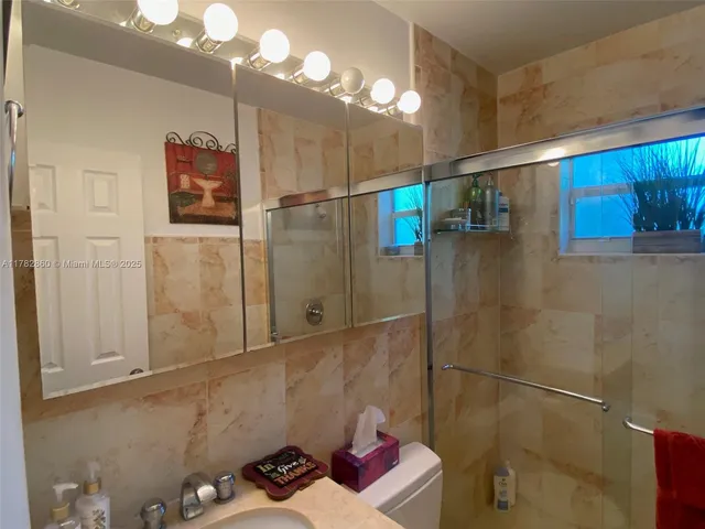 a bathroom with a sink and toilet