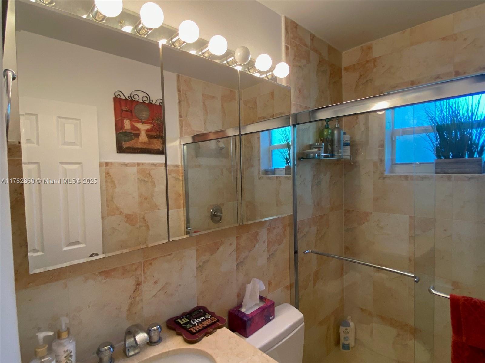 6331 Southwest 17th Street West Miami, FL 33155 - Photo 30 of 42 a bathroom with a shower