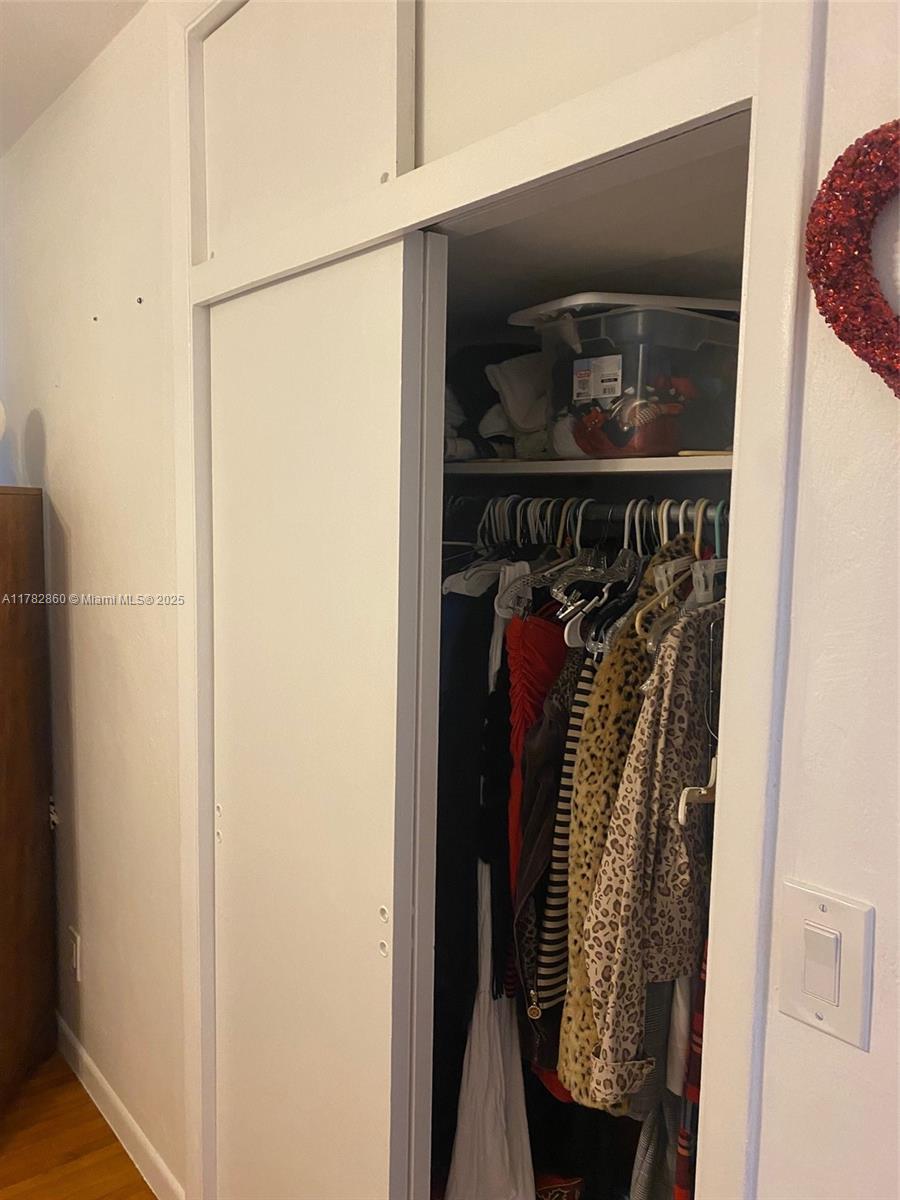 6331 Southwest 17th Street West Miami, FL 33155 - Photo 36 of 42 a view of walk in closet with clothes and shoes