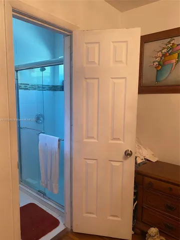 a view of a hallway with storage