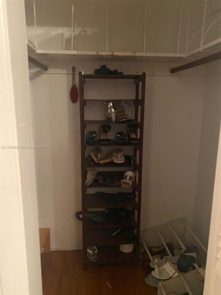 6331 Southwest 17th Street West Miami, FL 33155 - Photo 38 of 42 a view of walk in closet with clothes and shoes
