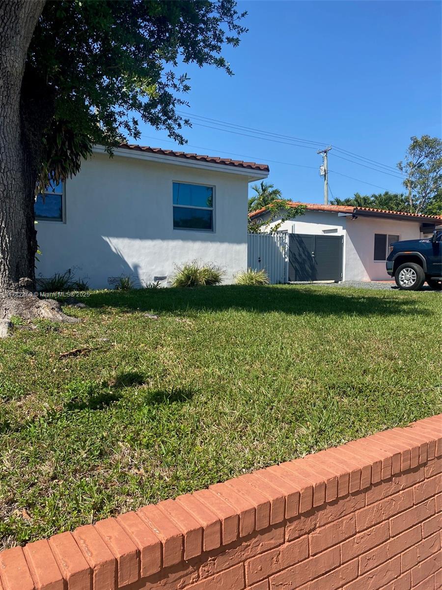 6331 Southwest 17th Street West Miami, FL 33155 - Photo 6 of 42 a front view of a house with a yard