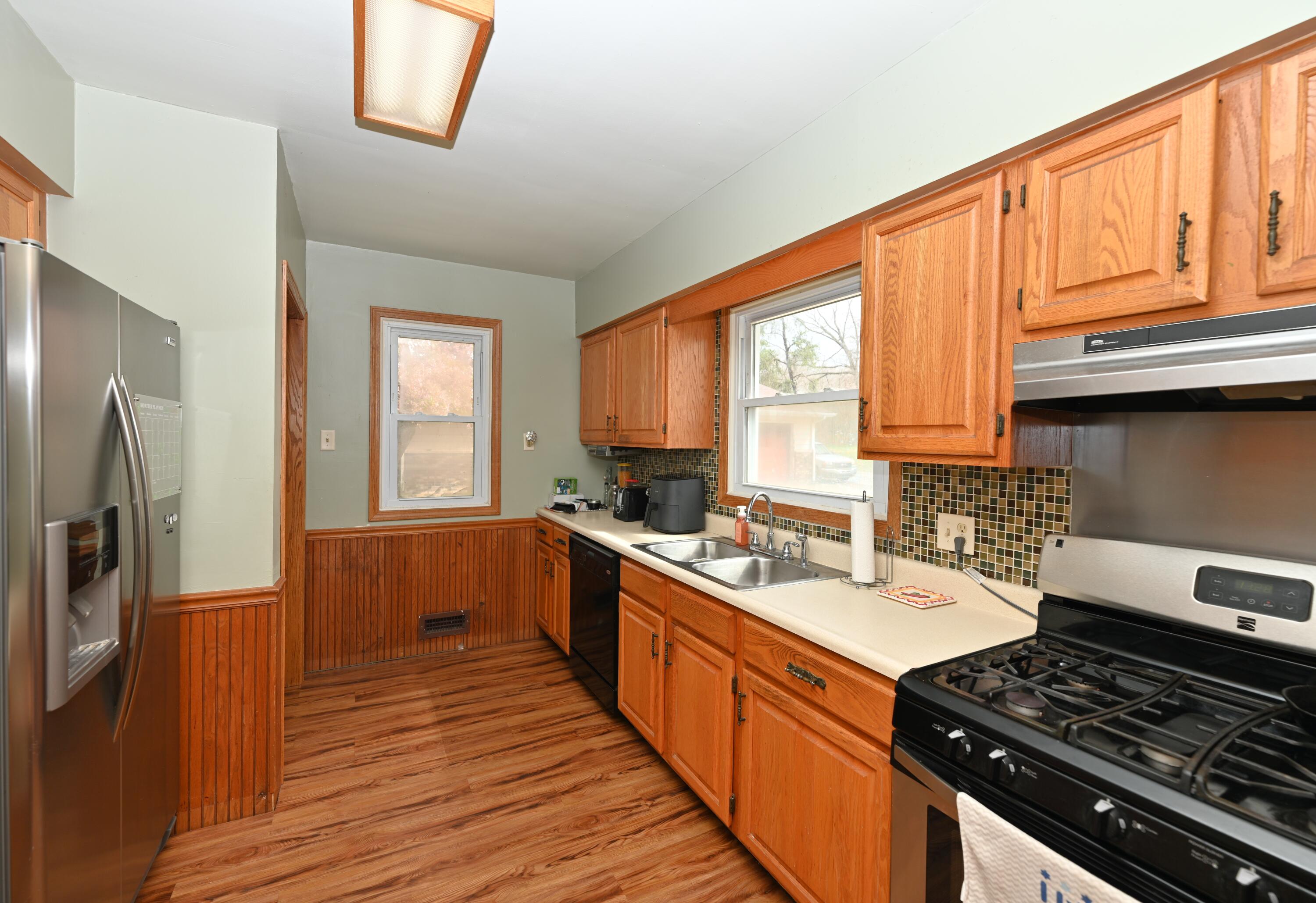 5110 West 400 North Winamac, IN 46996 - Photo 21 of 35 a kitchen with stainless steel appliances a stove sink and cabinets