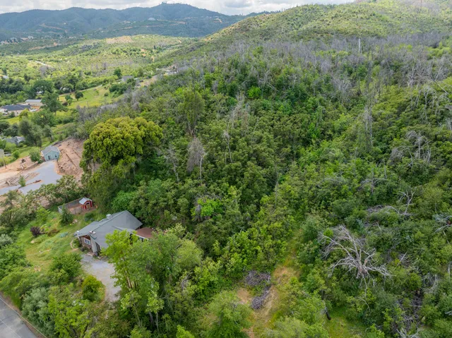 a view of house with outdoor seating area