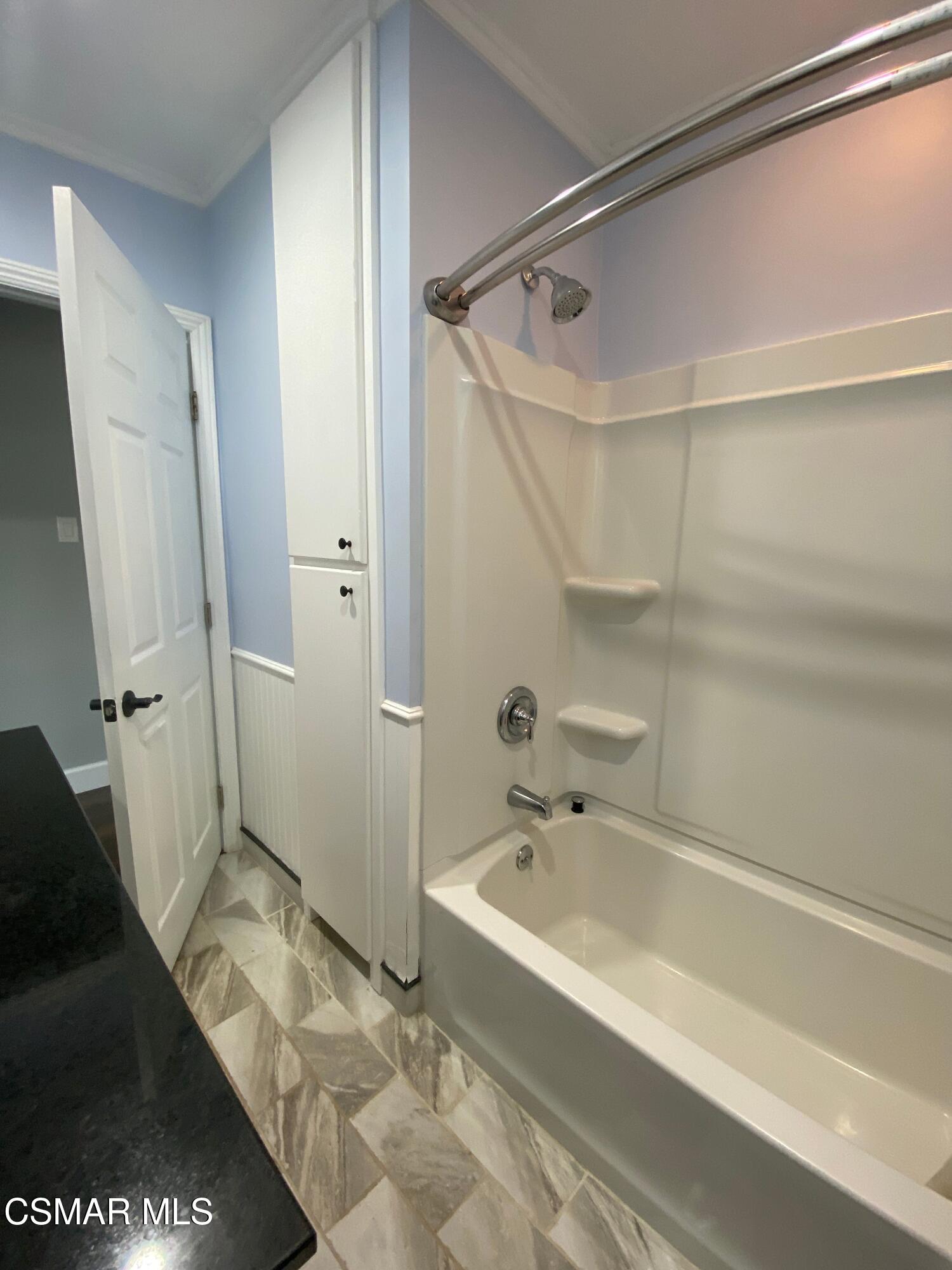 4511 Barnard Street Simi Valley, CA 93063 - Photo 11 of 25 a bathroom with a tub and a shower