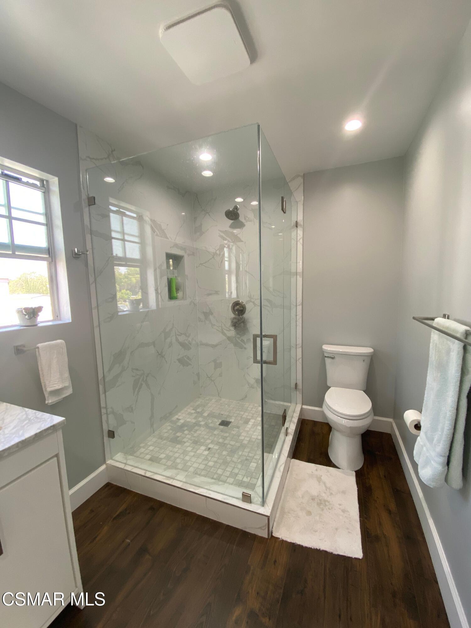 4511 Barnard Street Simi Valley, CA 93063 - Photo 16 of 25 a bathroom with a toilet and a shower