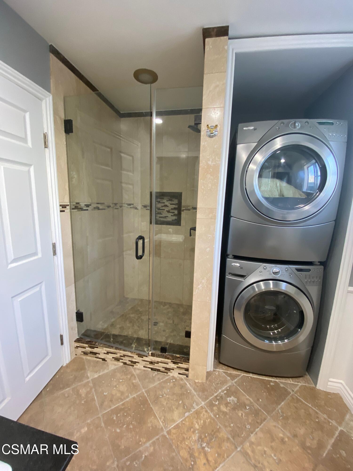 4511 Barnard Street Simi Valley, CA 93063 - Photo 19 of 25 a view of a bathroom with a washer and dryer