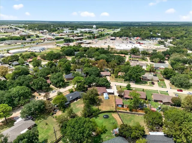 an aerial view of residential houses with outdoor space