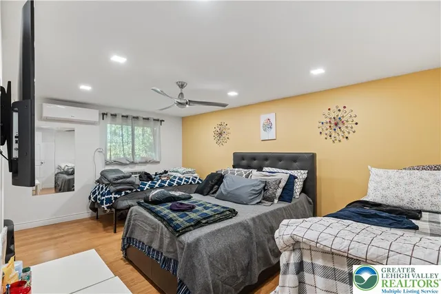 a bed room with two bed and a couch