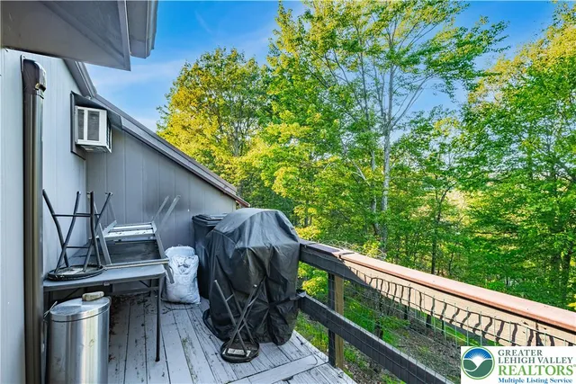 a view of a balcony with chairs