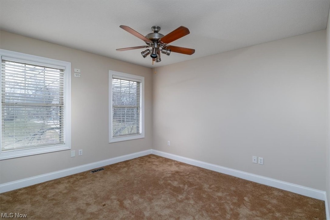 514 Silver Ridge Drive Akron, OH 44321 - Photo 30 of 47 Bedroom on 2nd level with ceiling fan and deep baseboard trim.