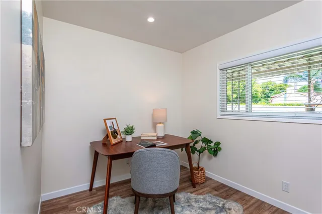 a workspace with furniture and a window