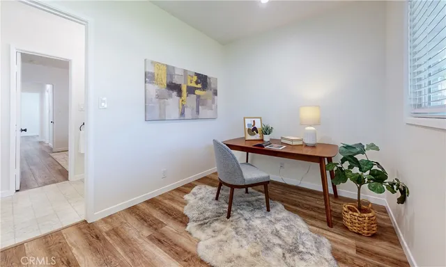 a workspace with furniture and window