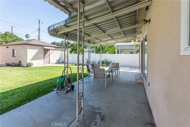 a view of yard with patio