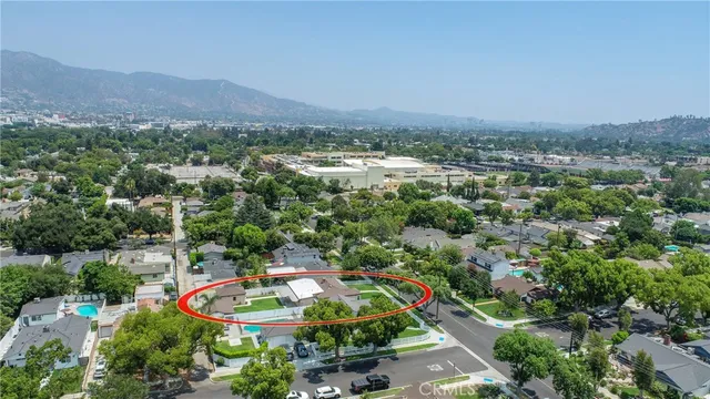 an aerial view of residential houses and outdoor space