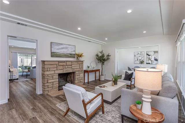 a living room with furniture and a fireplace