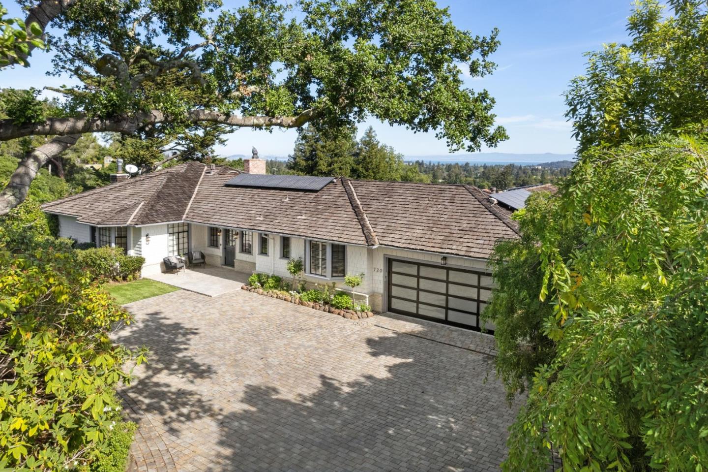 front view of a house with a garden