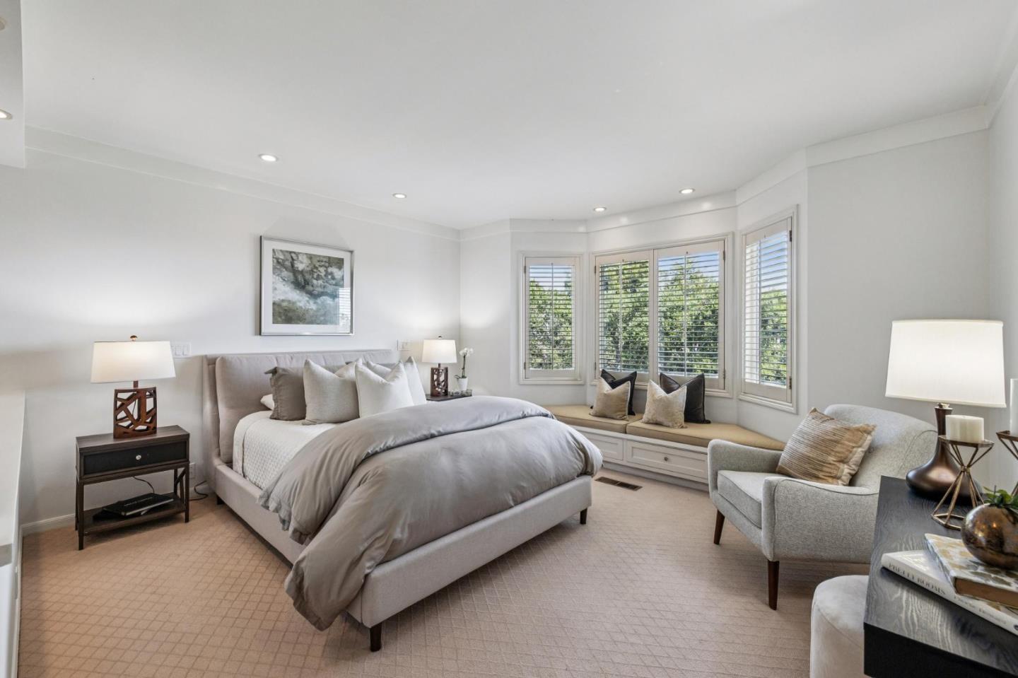 720 Endfield Way Hillsborough, CA 94010 - Photo 30 of 76 a spacious bedroom with a bed a couch and a lamp on dresser