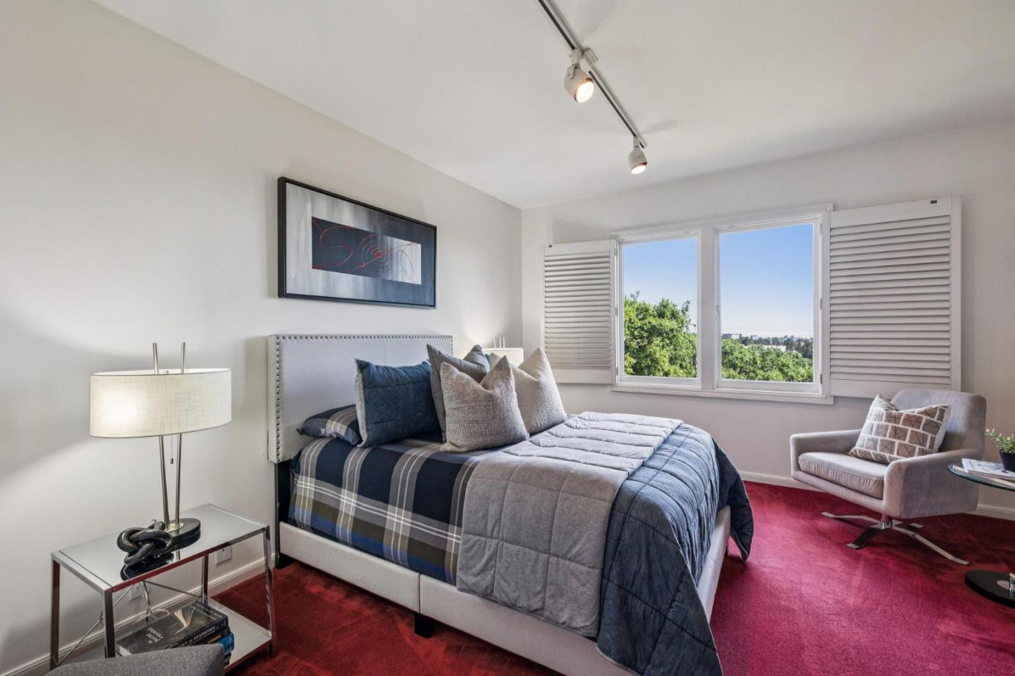 720 Endfield Way Hillsborough, CA 94010 - Photo 37 of 76 a bedroom with a bed and a lamp